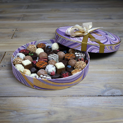 Selection of fine chocolates in a marble pattern theatre gift box