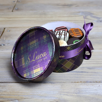 Selection of fine chocolates in a tartan pattern theatre gift box