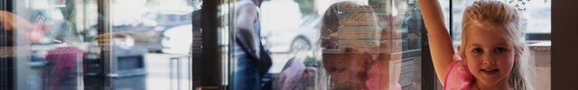 Young girl standing at the ice cream counter