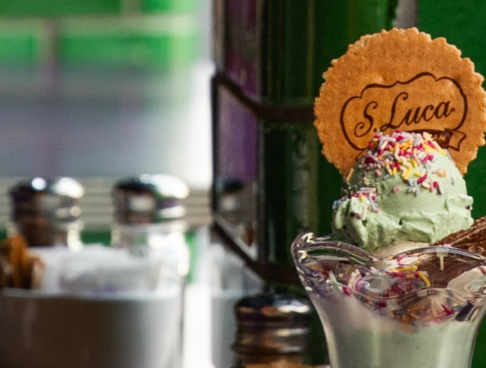 Mint ice cream with sprinkles and flake